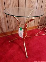 Side view showing glass top and brass frame