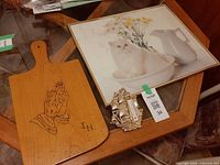 All three items together: cutting board, framed cat print, gold-tone ship thermometer