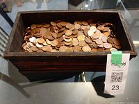 top view of wooden box filled with Canadian pennies