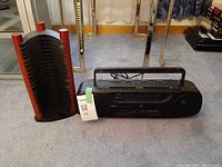 Yorx boombox and CD rack side by side