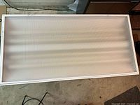 Front view of one fluorescent fixture showing prismatic diffuser