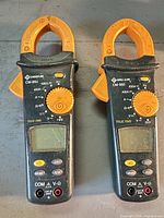 Two Greenlee CM-950 clamp meters front view