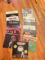 Overview of full lot showing multiple album covers laid out on floor