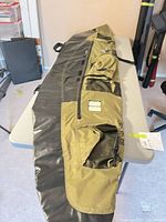 Full deflated pontoon showing pockets, straps and overall condition