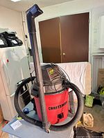 Full view of Craftsman blower/vacuum with hose and tube attached