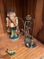 Both sculptures side by side showing scale and details