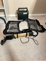 Humminbird carry case, mesh weigh bag and wooden transducer mount laid out together