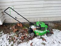 Side view of Lawn-Boy mower showing full unit, handle, and deck