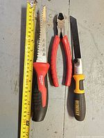All three tools laid out with tape measure reference