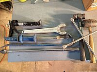 All seven heavy tools laid out on bench