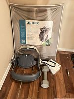 Overall lot showing Orthex cushion box, Ortho Active brace, 10 lb dumbbell, boxed hearing tech