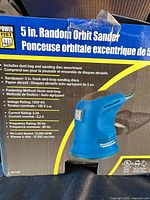 Box of Power Fist 5 in. random orbit sander showing specifications