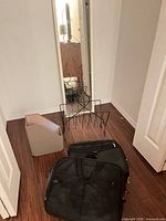 all items together: mirror, magazine rack, file holder, two laptop bags