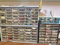 Front view of three drawer cabinets filled with labeled drawers