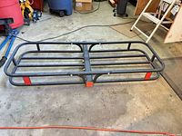 Top view of steel hitch cargo basket showing frame, rails and reflectors