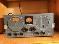 Front panel showing tuning dials, speaker grille, controls