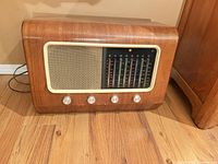 Front view of Pye valve radio showing cabinet, speaker grille, tuning scale and knobs