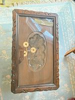 Top view showing carved birds under cracked glass insert