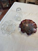 All three glass pieces on table: carnival bowl, clear dish, carafe