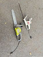 Poulan chainsaw and Craftsman hedge trimmer side by side on ground
