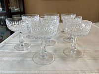 All eight glasses on table, angled side view