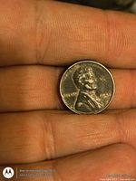 Obverse of 1943 Lincoln steel cent in hand