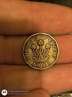 Reverse showing thrift plant, date 1941, THREE PENCE inscription