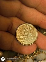 Reverse side showing men’s hockey design and year 2009