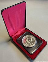 Coin in open presentation case