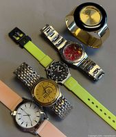 Group view of five watches showing overall variety