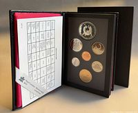 Case opened showing coins and spec card