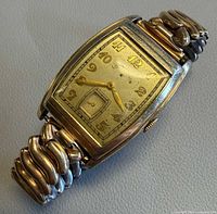 Angled view of complete watch showing case, dial and bracelet