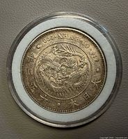 Obverse dragon design inside holder