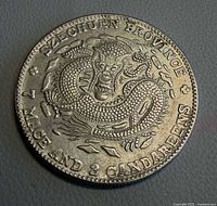 Obverse showing dragon and English legend