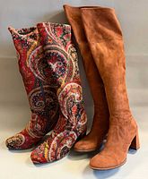 Both pairs of boots standing side by side showing overall appearance