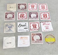 Top overview of all sixteen packaged guitar strings