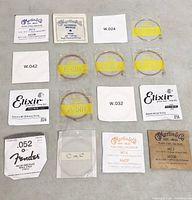 All 16 guitar strings laid out in four-by-four grid