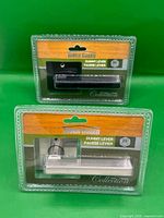 Front view of both packaged Tough Guard dummy levers showing finishes