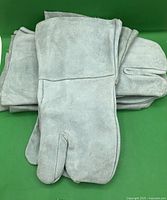 Stack of gray suede welding gloves
