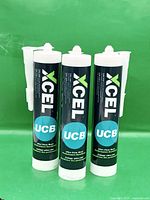 Front view of three Xcel UCB adhesive cartridges