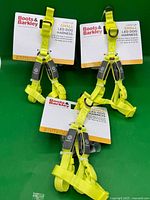 Three packaged neon yellow LED dog harnesses