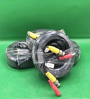 Four coiled DVR camera cables wrapped in plastic