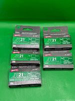 All five Arrow JT21 staple boxes arranged on green background