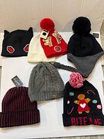 All seven beanies laid out together