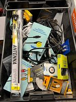 Bin overview showing antenna package, multiple cable packs, loose cables