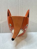 Front view of ceramic fox head planter