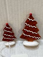 Front view of both gingerbread tree figurines