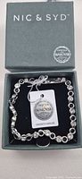 Bracelet in NIC & SYD box with tag visible