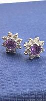 Front view of both sterling silver amethyst stud earrings