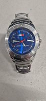 Front view of Tommy Hilfiger stainless steel quartz watch displaying blue dial
